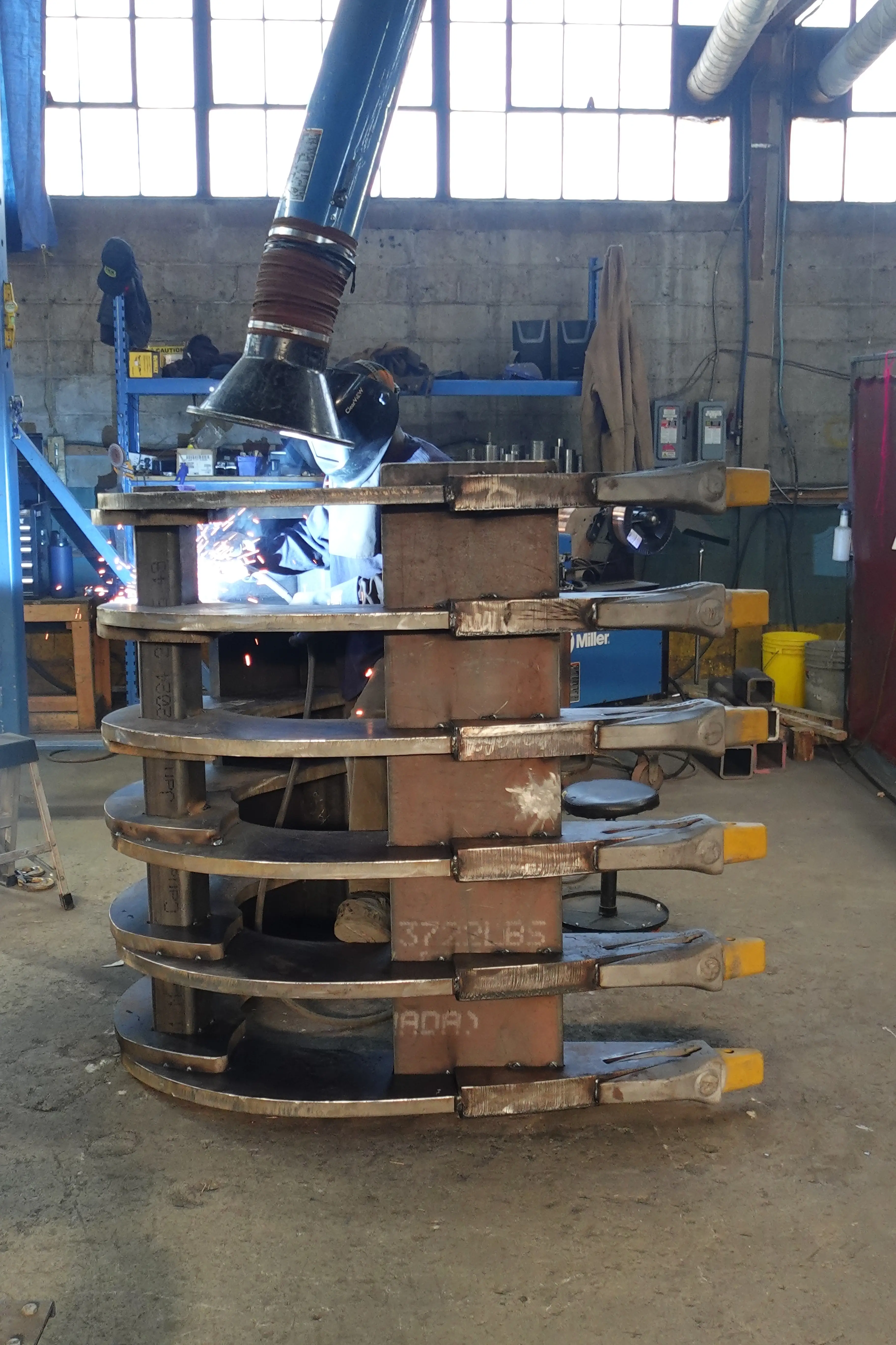 image of lifco employee welding a rake