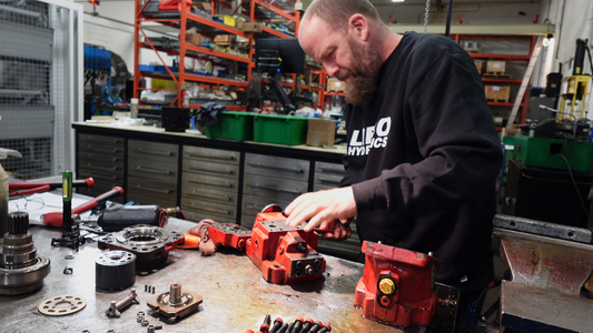 image of lifco hydraulic technician fixing a pump